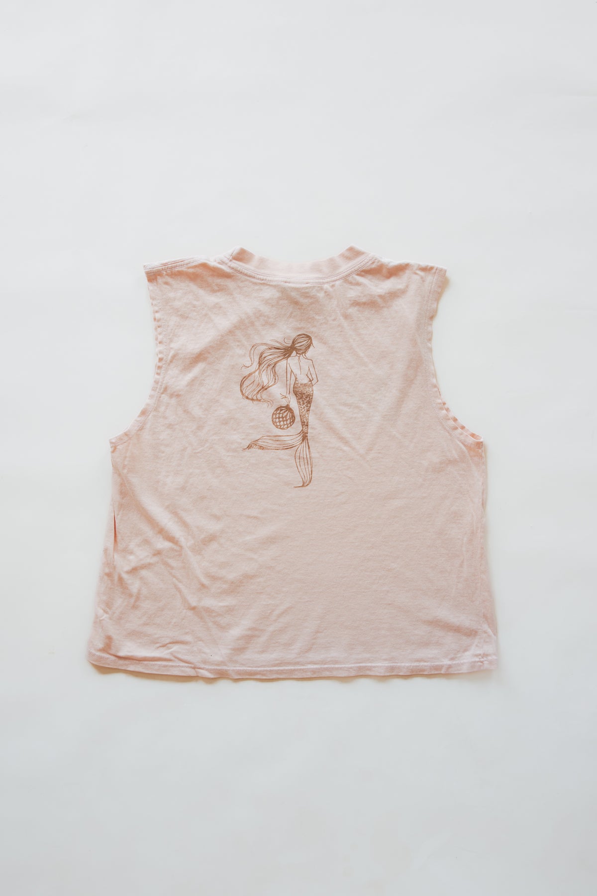 Wings Hawaii women's Mermaid Muscle Tank Top in Seashell Pink. Original artwork screenprinted by hand in Maui. Aloha design on front, mermaid on back. 