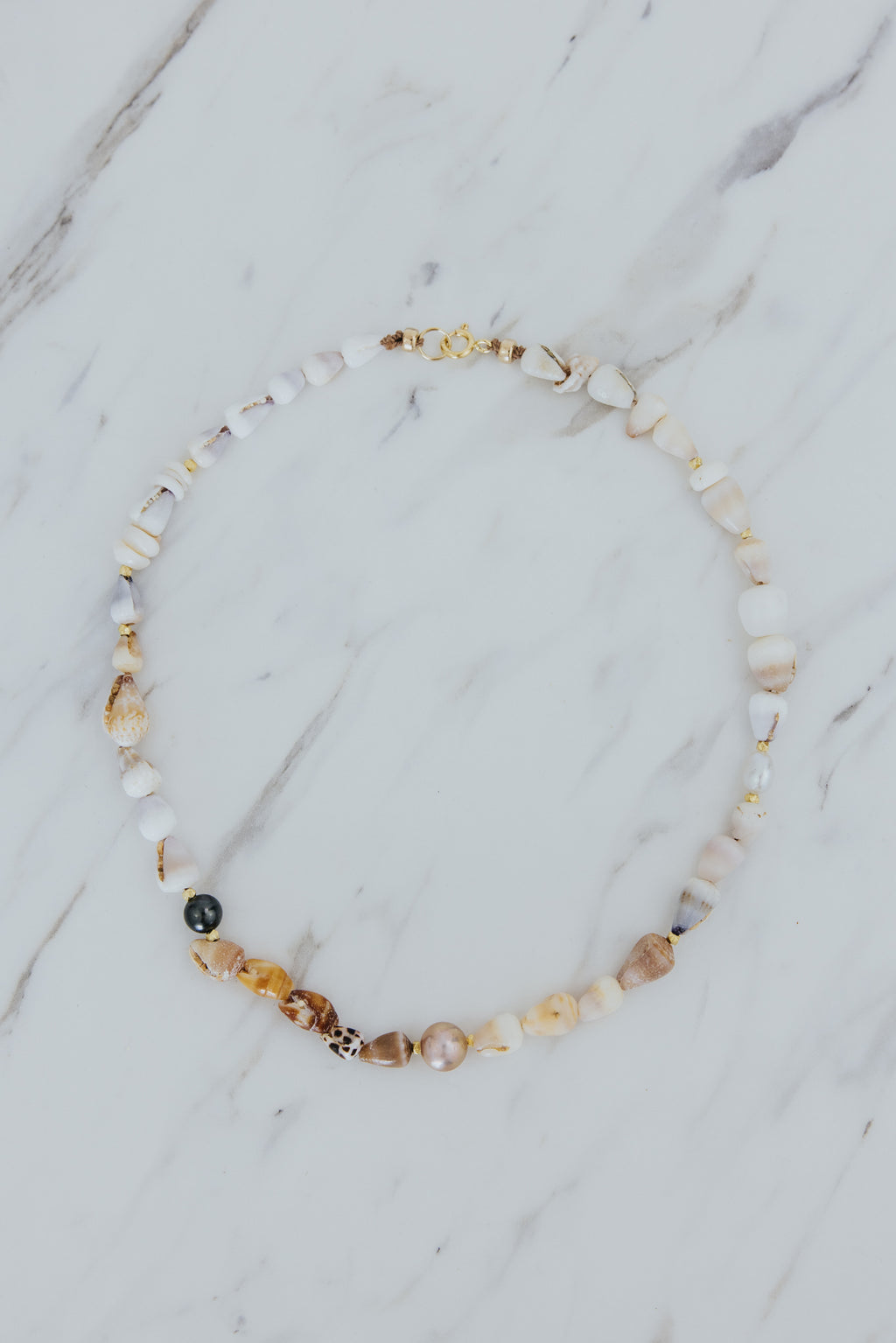 Wings Hawaii Mermaid's Treasure Necklace. Real Hawaiian cone shells and Tahitian pearls choker handcrafted in Maui. Elevated shell jewelry handmade in Hawaii. 