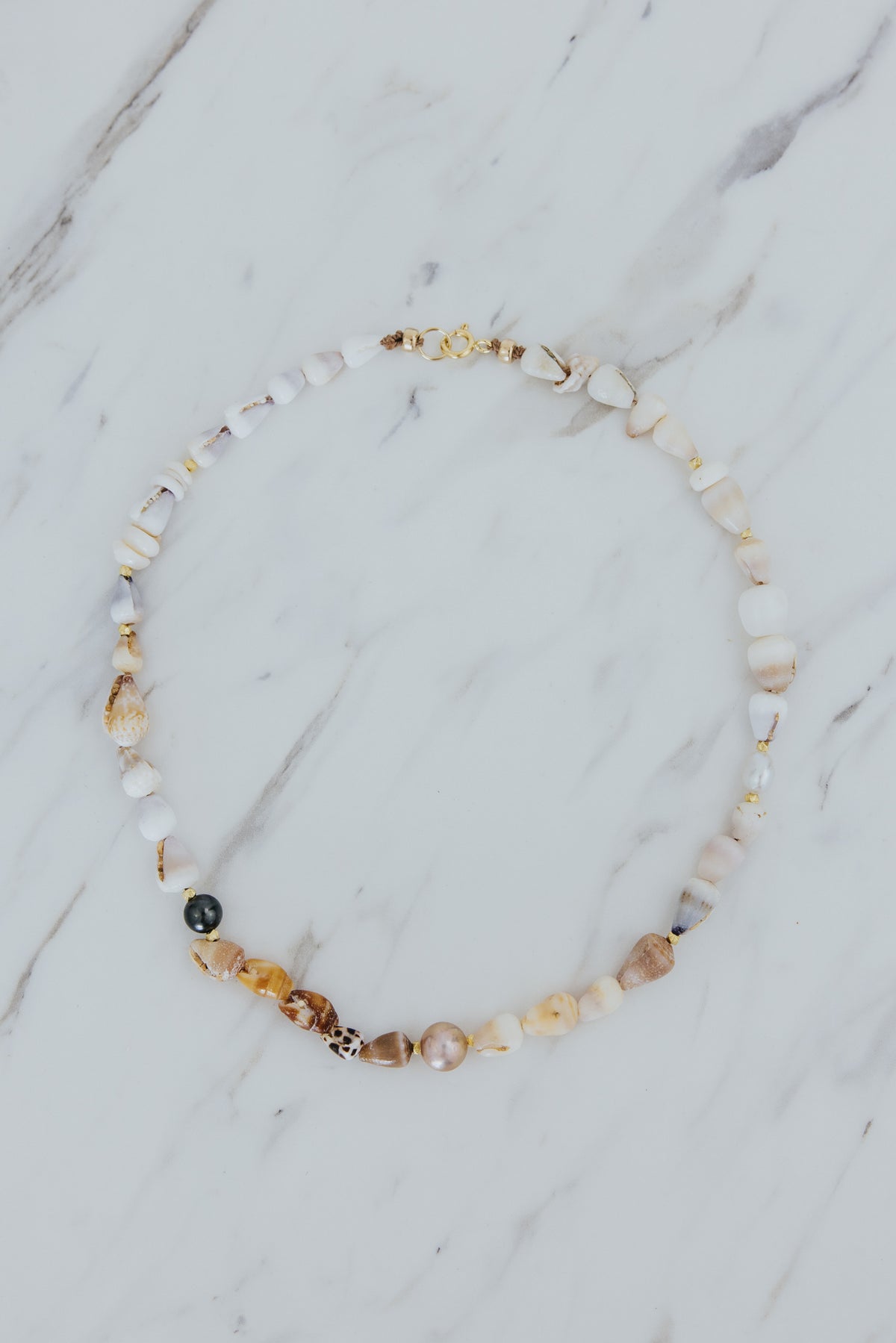Wings Hawaii Mermaid's Treasure Necklace. Real Hawaiian cone shells and Tahitian pearls choker handcrafted in Maui. Elevated shell jewelry handmade in Hawaii. 