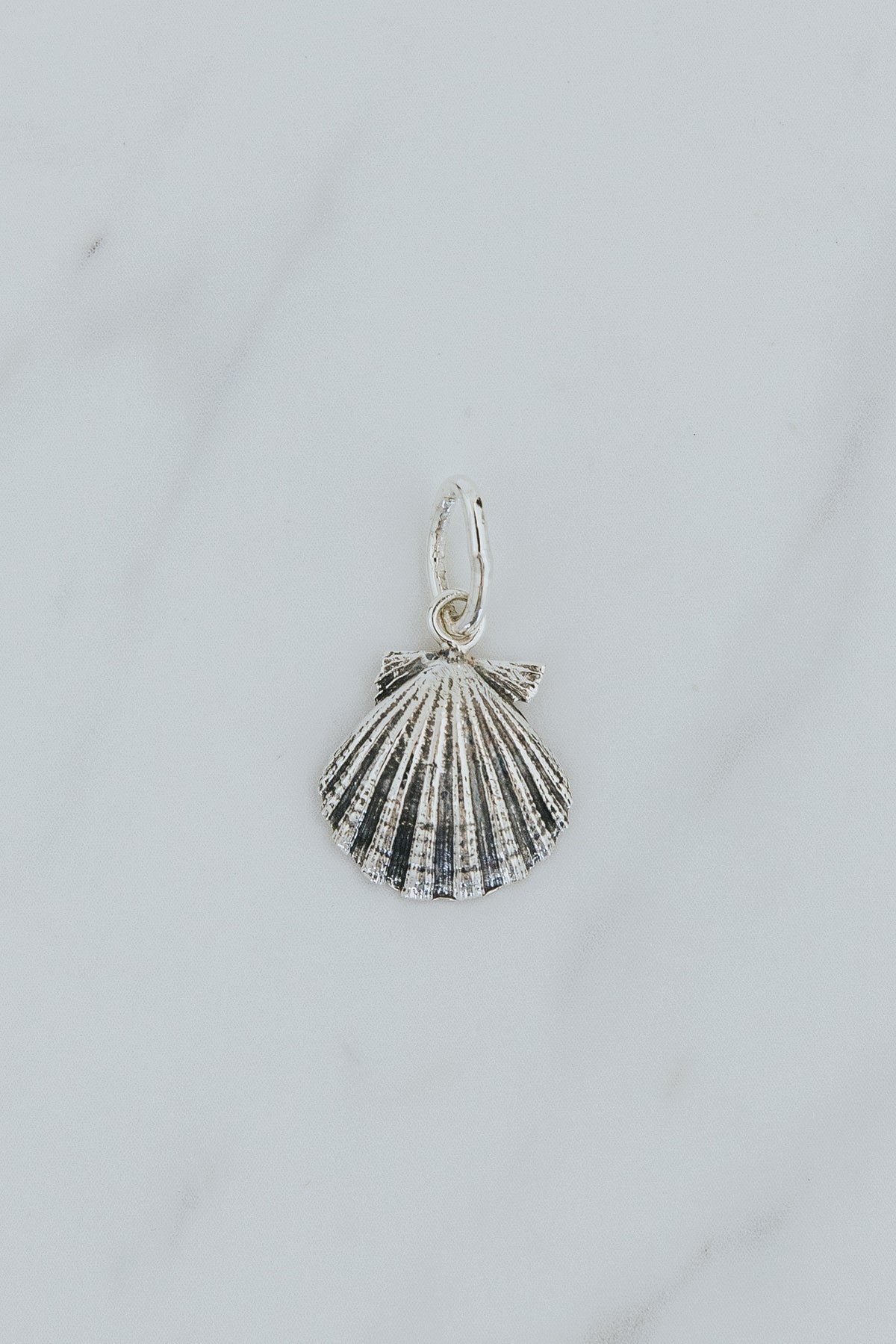 Wings Hawaii Forever Sunrise Shell Necklace Charm in sterling silver. Fine jewelry handmade in Maui. 