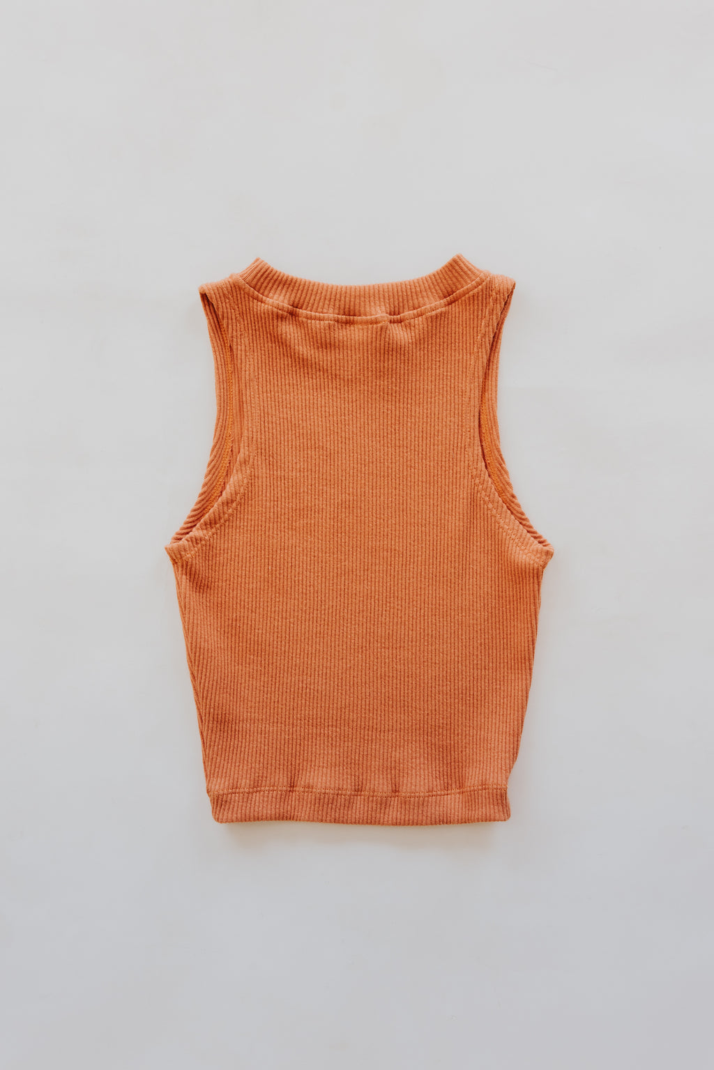 Wings Hawaii Ribbed Lexi Tank Top. Stretchy high neck cropped tank top in Rust orange. Designed in Maui, sewn in Bali. Sustainable, small batch, boho beachy chic women's apparel.