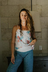Model wearing Wings Hawaii pau hana pants in quilted ulu and plumeria print in surf blue  thumbnail