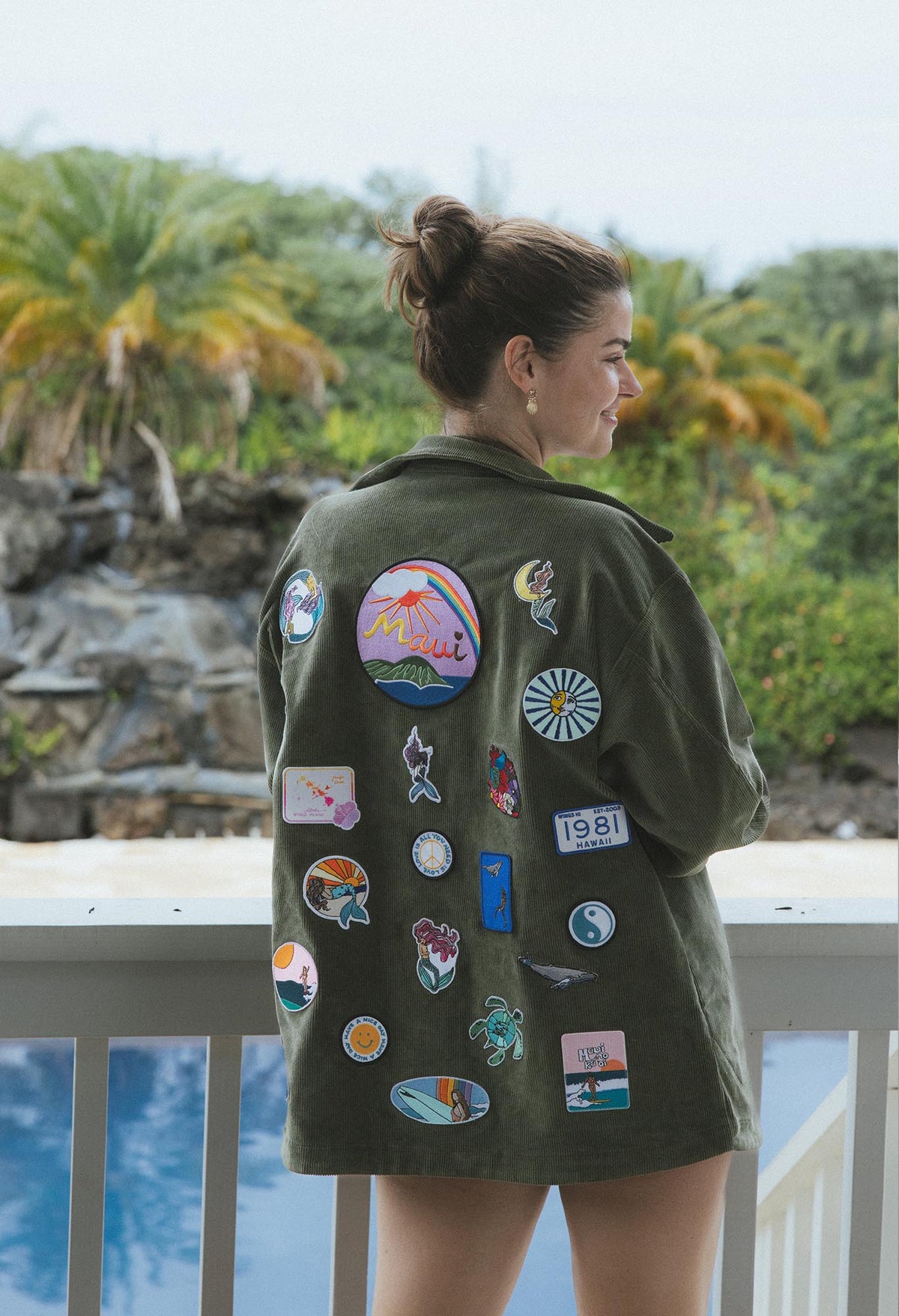 Wings Hawaii patched up army jacket. Handmade in Maui. Upcycled and one-of-a-kind. Original artwork patches with mermaid, sea turtles, rainbows, surfer girls, Maui island, tropical themes and more. 