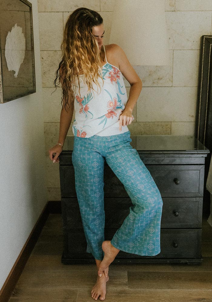 Model in floral pants and a cami