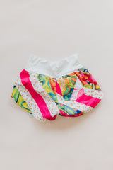 Wings Hawaii Patchwork Pau Hana Shorts in Tropic Rush. Handmade, one of a kind, upcycled vintage quilt fabric. Stretchy cotton waistband and back pocket. Made with aloha in Maui. Sustainable, small batch, slow fashion.  thumbnail