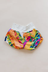Wings Hawaii Patchwork Pau Hana Shorts in Tropic Rush. Handmade, one of a kind, upcycled vintage quilt fabric. Stretchy cotton waistband and back pocket. Made with aloha in Maui. Sustainable, small batch, slow fashion.  thumbnail