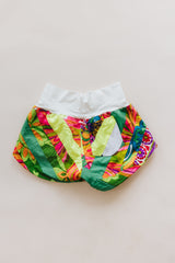 Wings Hawaii Patchwork Pau Hana Shorts in Tropic Rush. Handmade, one of a kind, upcycled vintage quilt fabric. Stretchy cotton waistband and back pocket. Made with aloha in Maui. Sustainable, small batch, slow fashion.  thumbnail