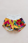 Wings Hawaii Patchwork Pau Hana Shorts in Tropic Rush. Handmade, one of a kind, upcycled vintage quilt fabric. Stretchy cotton waistband and back pocket. Made with aloha in Maui. Sustainable, small batch, slow fashion. 