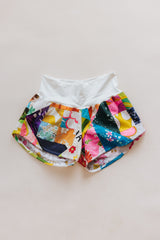 Wings Hawaii Patchwork Pau Hana Shorts in Daisy Lane. Handmade, one of a kind, upcycled vintage quilt fabric. Cozy cotton waistband and back pocket. Made with aloha in Maui. Sustainable, small batch, slow fashion.  thumbnail