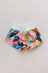 Wings Hawaii Patchwork Pau Hana Shorts in Daisy Lane. Handmade, one of a kind, upcycled vintage quilt fabric. Cozy cotton waistband and back pocket. Made with aloha in Maui. Sustainable, small batch, slow fashion.  thumbnail