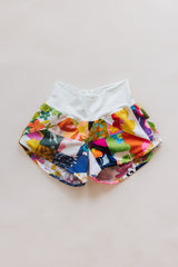 Wings Hawaii Patchwork Pau Hana Shorts in Daisy Lane. Handmade, one of a kind, upcycled vintage quilt fabric. Cozy cotton waistband and back pocket. Made with aloha in Maui. Sustainable, small batch, slow fashion.  thumbnail