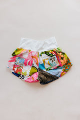 Wings Hawaii Patchwork Pau Hana Shorts in Daisy Lane. Handmade, one of a kind, upcycled vintage quilt fabric. Cozy cotton waistband and back pocket. Made with aloha in Maui. Sustainable, small batch, slow fashion.  thumbnail