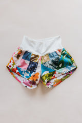 Wings Hawaii Patchwork Pau Hana Shorts in Daisy Lane. Handmade, one of a kind, upcycled vintage quilt fabric. Cozy cotton waistband and back pocket. Made with aloha in Maui. Sustainable, small batch, slow fashion.  thumbnail