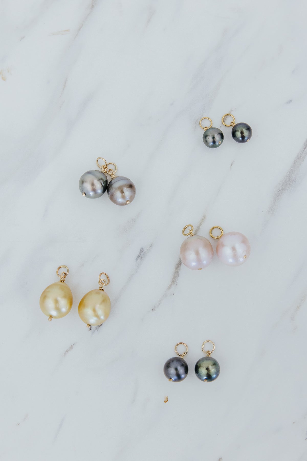 Wings Hawaii Pearl earring charms in solid 14k yellow gold. Fine jewelry handmade with aloha in Maui. Pink freshwater pearls, Tahitian pearls, Golden South Seas Pearls. Made to pair with Charm Bar Mix + Match Hoop Earrings.