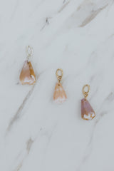 Wings Hawaii pink and purple Cone Shell necklace charms in 14k gold-filled or sterling silver. Fine shell jewelry handcrafted in Maui. Modern beachy charm necklaces handmade with authentic Hawaiian sea shells. 