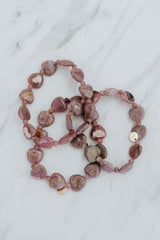 Wings Hawaii Rhodochrosite heart-shaped beads stretchy bracelet with 14k gold-filled tag. Crystal chakra healing. Boho-chic spiritual jewelry handmade in Maui.