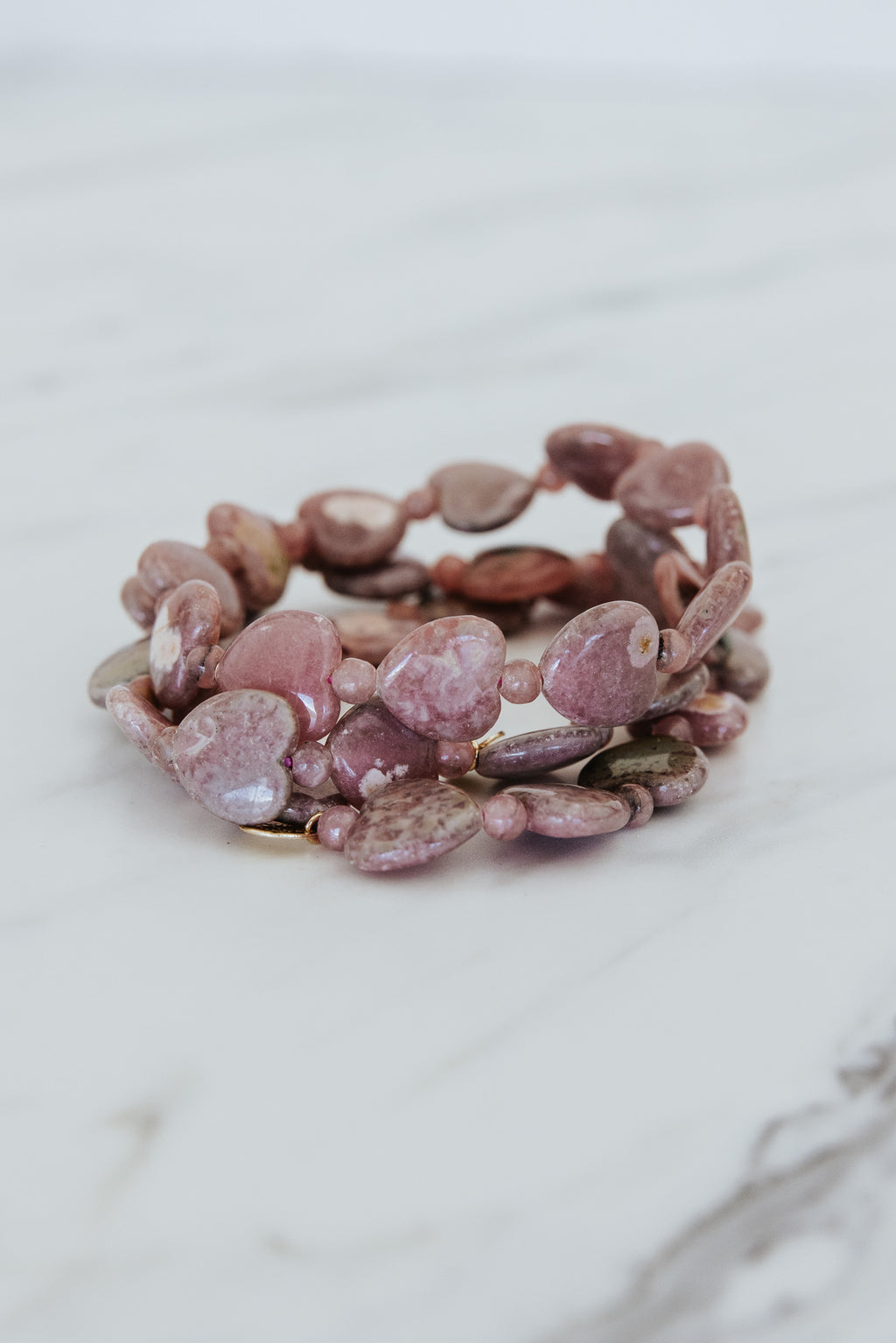 Wings Hawaii Rhodochrosite heart-shaped beads stretchy bracelet with 14k gold-filled tag. Crystal chakra healing. Boho-chic spiritual jewelry handmade in Maui.