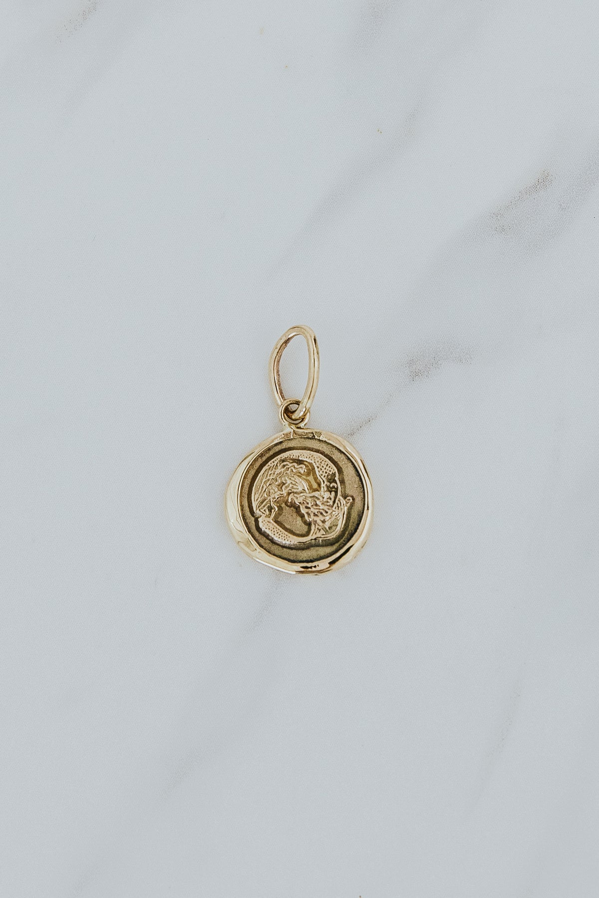 Wings Hawaii mermaid seal necklace charm in solid 14k yellow gold. Exclusive Wings Hawaii original artwork. Fine jewelry handcrafted in Maui. 