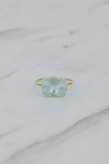 Wings Hawaii Halo ring – Aquamarine in 14K yellow gold. Fine jewelry handcrafted in Maui. Oval-cut gemstone, single prong-set on delicate band. Made in Hawaii gifts.