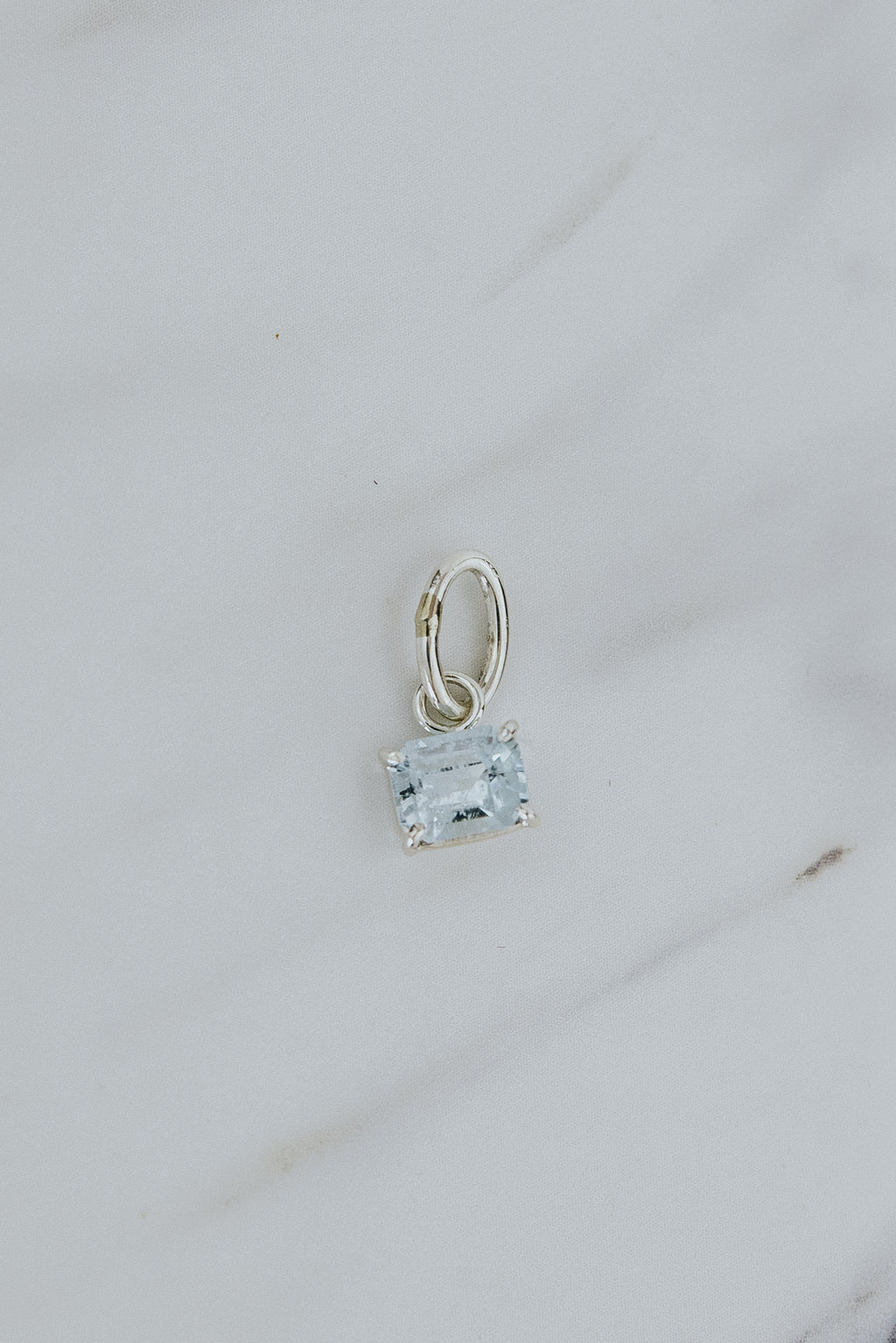 Wings Hawaii aquamarine necklace charm, prong-set in sterling silver. Fine jewelry handcrafted in Maui. Mix, match, customize modern charm jewelry at the Wings Hawaii Charm Bar. 
