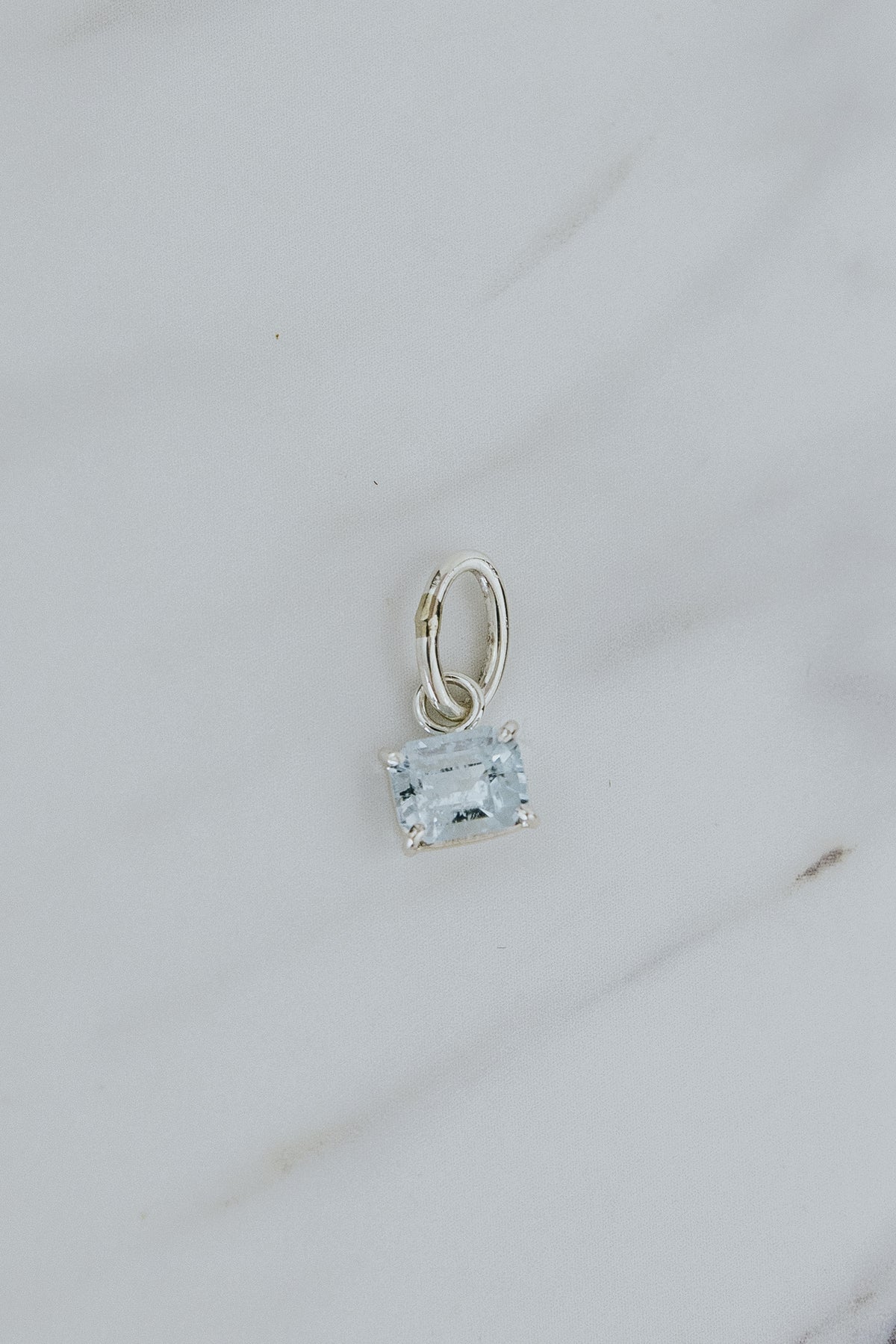 Wings Hawaii aquamarine necklace charm, prong-set in sterling silver. Fine jewelry handcrafted in Maui. Mix, match, customize modern charm jewelry at the Wings Hawaii Charm Bar. 