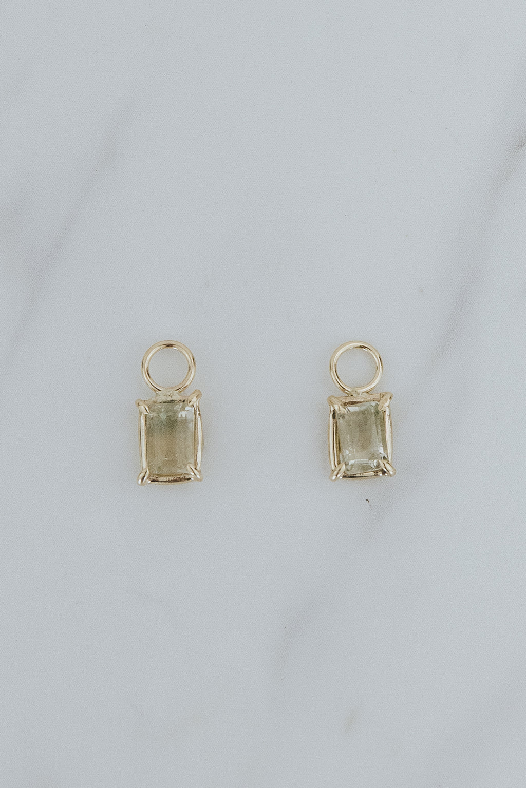 Wings Hawaii earring charms, bi-color Sunstones, clear to light green, in 14k yellow gold. Fine jewelry handmade in Maui. 