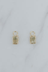 Wings Hawaii earring charms, bi-color Sunstones, clear to light green, in 14k yellow gold. Fine jewelry handmade in Maui. 