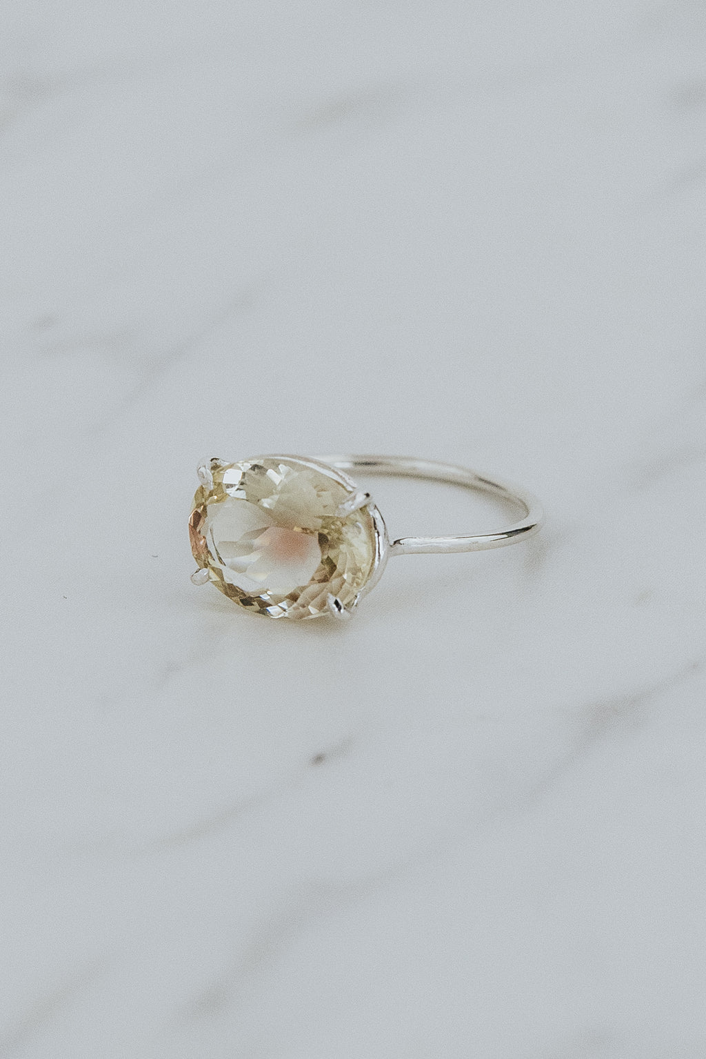 Wings Hawaii Halo ring – Bi-color Sunstone in sterling silver. Fine jewelry handcrafted in Maui. Oval-cut gemstone, single prong-set on delicate band. Made in Hawaii gifts. 