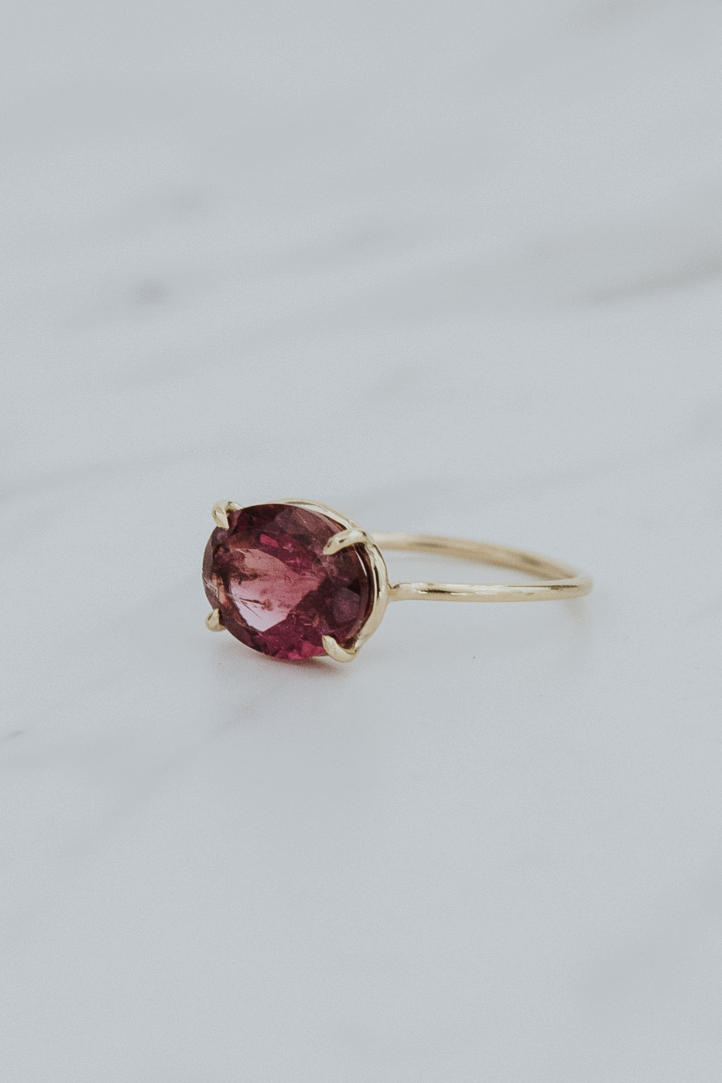 Wings Hawaii Halo ring – Pink Tourmaline in solid 14k yellow gold. Fine jewelry handcrafted in Maui. Oval-cut gemstone, single prong-set on delicate band. 
