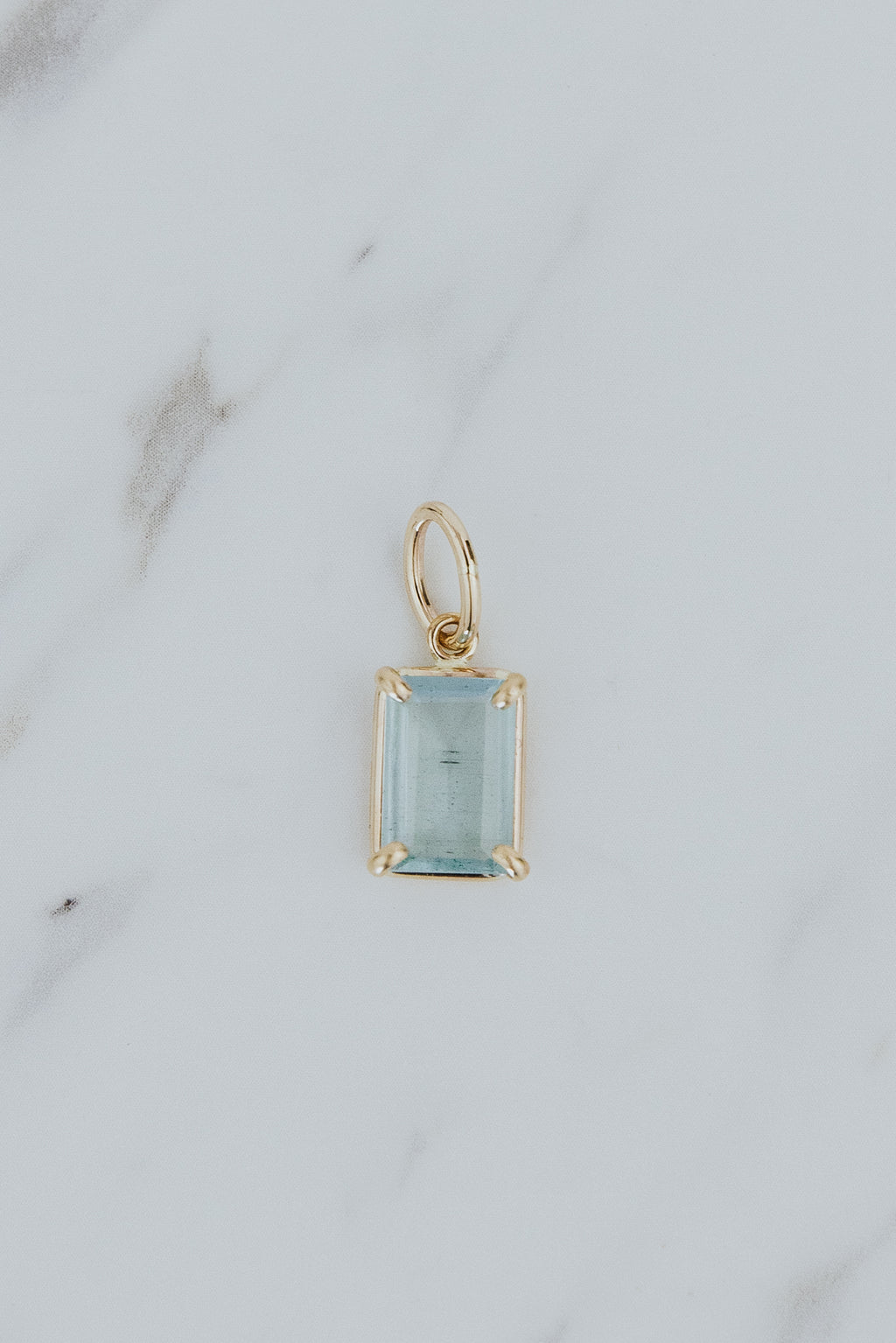 Wings Hawaii Aquamarine necklace charm. Emerald-cut and prong-set in 14k gold-filled. Fine jewelry handcrafted with aloha in Maui. Charm Bar collection. Mix, match, customize modern charm jewelry made in Hawaii. 