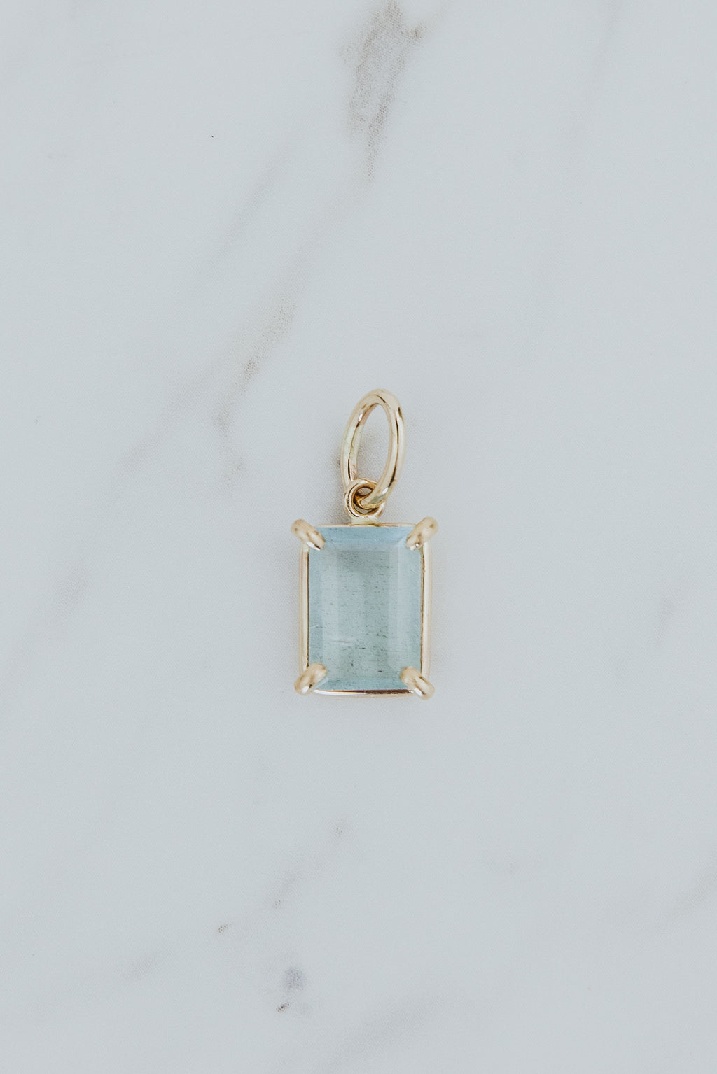 Wings Hawaii Aquamarine necklace charm. Emerald-cut and prong-set in 14k gold-filled. Fine jewelry handcrafted with aloha in Maui. Charm Bar collection. Mix, match, customize modern charm jewelry made in Hawaii. 