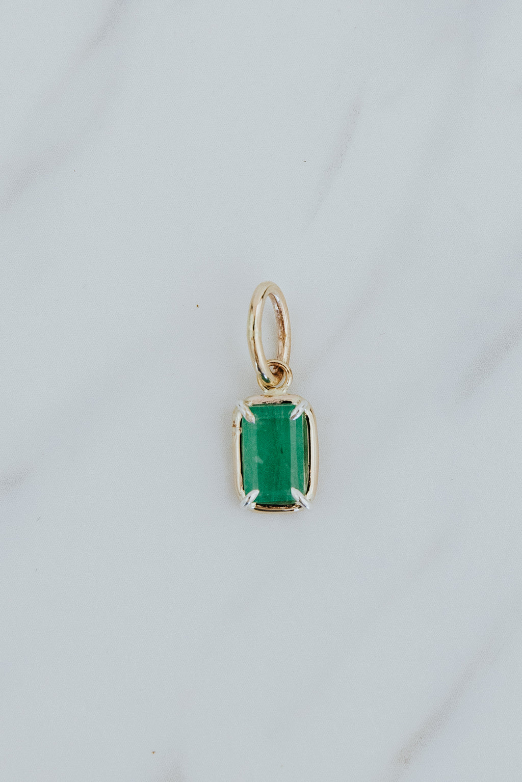 Wings Hawaii emerald green necklace charm in 14k gold-filled and sterling silver mixed metals. Fine jewelry handcrafted in Maui. 