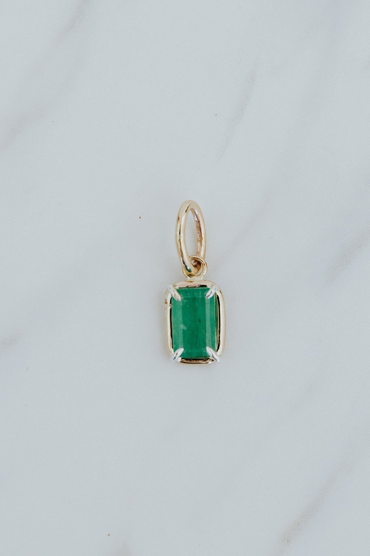 Wings Hawaii emerald green necklace charm in 14k gold-filled and sterling silver mixed metals. Fine jewelry handcrafted in Maui. 