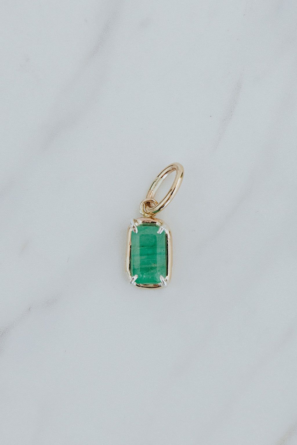 Wings Hawaii emerald green necklace charm in 14k gold-filled and sterling silver mixed metals. Fine jewelry handcrafted in Maui. 