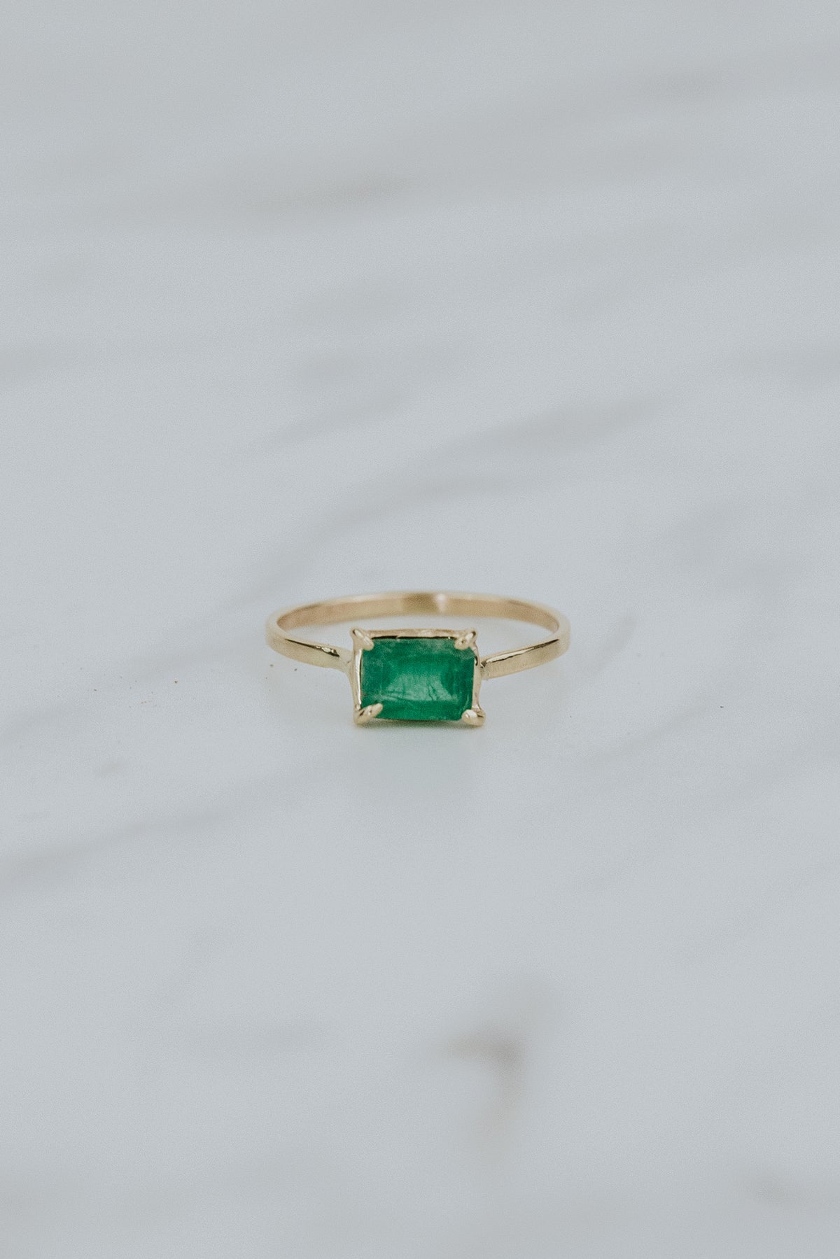 Wings Hawaii petite Astra ring with emerald in solid 14 yellow gold. Fine jewelry handcrafted in Maui. May birthstone gift, unique jewelry made in Hawaii. 