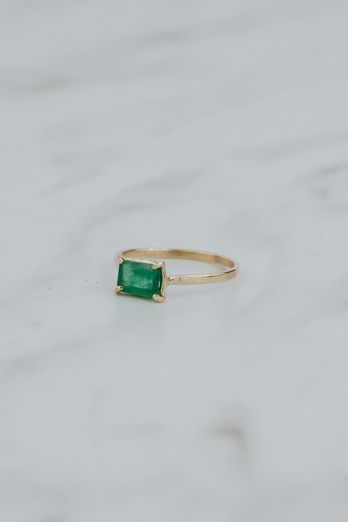 Wings Hawaii petite Astra ring with emerald in solid 14 yellow gold. Fine jewelry handcrafted in Maui. May birthstone gift, unique jewelry made in Hawaii. 