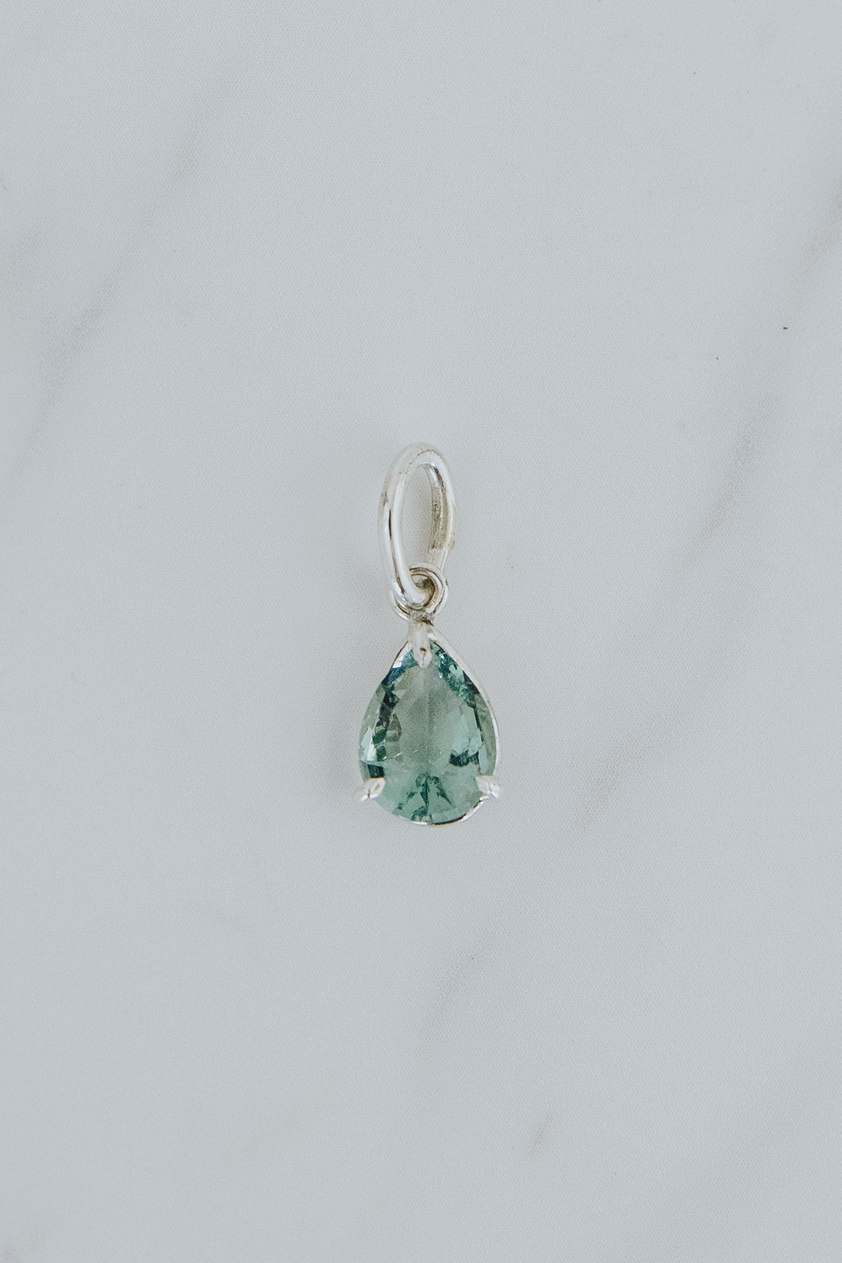 Wings Hawaii fluorite necklace charm pendant in sterling silver. Aqua blue, ocean green teardrop gemstone. Fine jewelry handcrafted with aloha in Maui. 