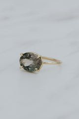 Wings Hawaii Halo ring – Green Tourmaline in solid 14k yellow gold. Fine jewelry handcrafted in Maui. Oval-cut gemstone, single prong-set on delicate band. Made in Hawaii gifts.  thumbnail