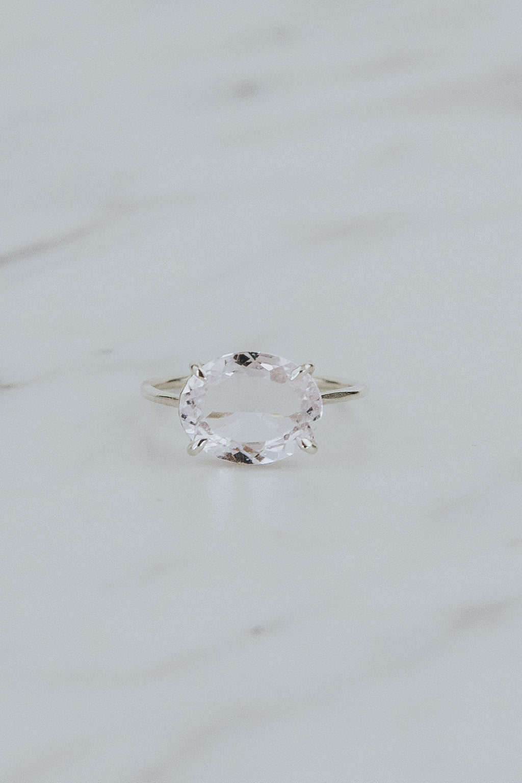 Wings Hawaii Halo ring – Morganite in sterling silver. Fine jewelry handcrafted in Maui. Oval-cut gemstone, single prong-set on delicate band. Made in Hawaii gifts. 