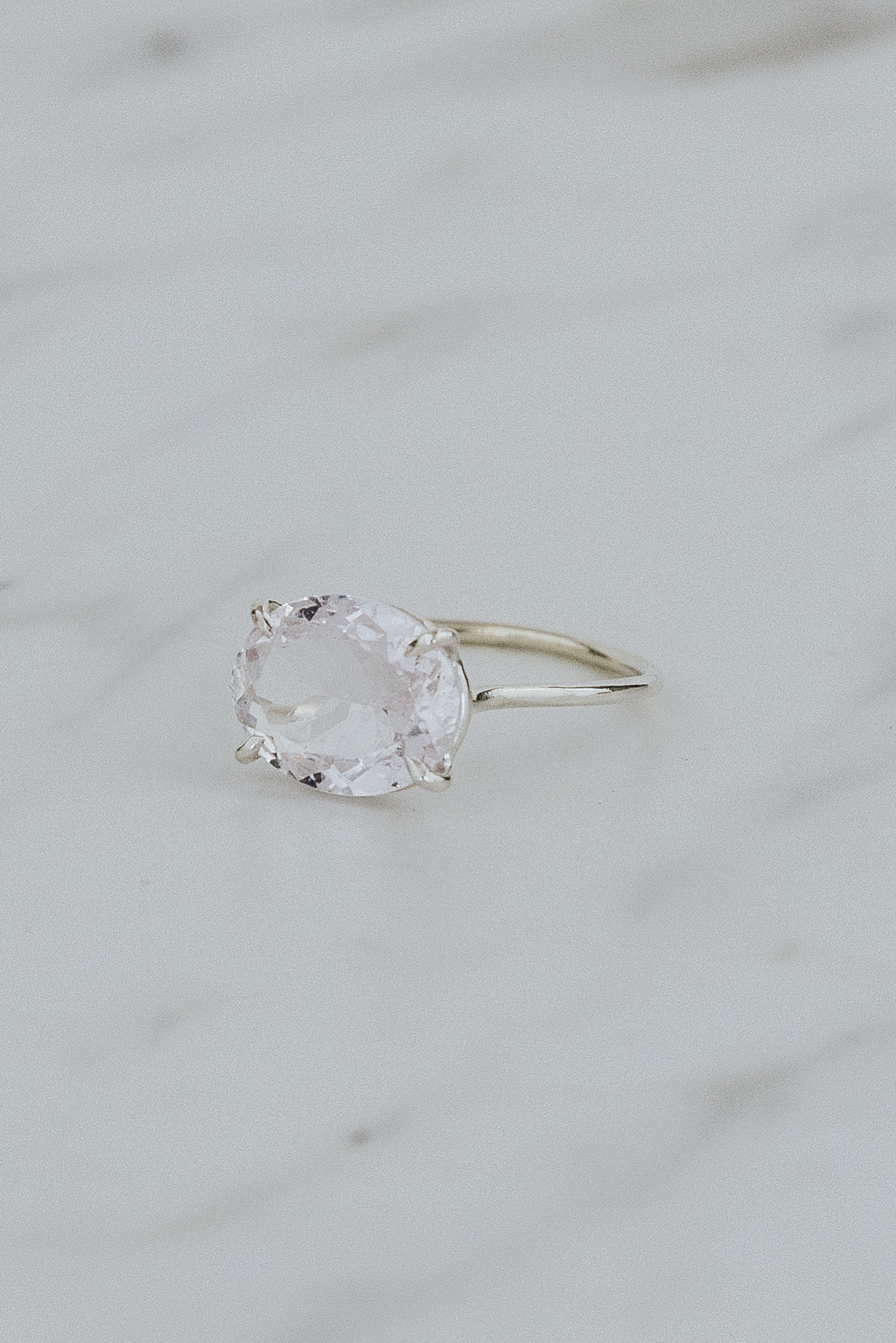 Wings Hawaii Halo ring – Morganite in sterling silver. Fine jewelry handcrafted in Maui. Oval-cut gemstone, single prong-set on delicate band. Made in Hawaii gifts. 