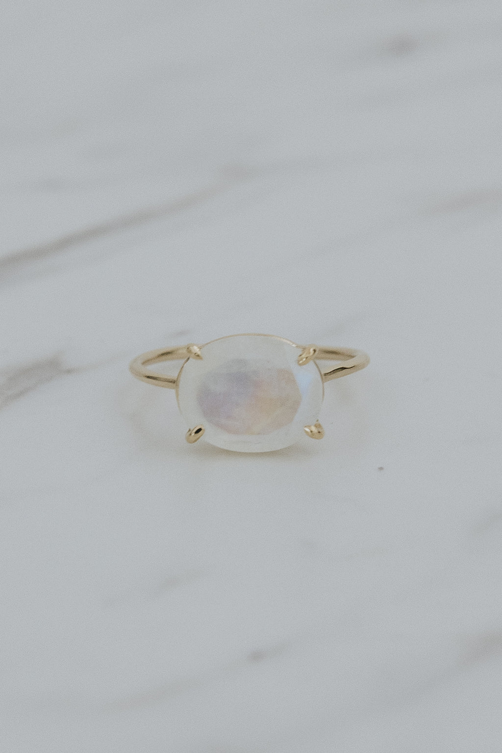 Wings Hawaii Halo ring – Moonstone in solid 14k yellow gold. Fine jewelry handcrafted in Maui. Oval-cut gemstone, single prong-set on delicate band. Made in Hawaii gifts. 
