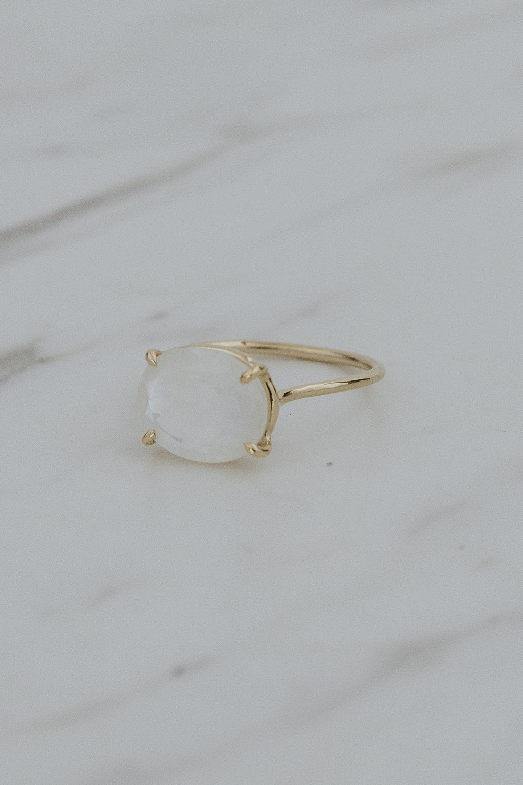 Wings Hawaii Halo ring – Moonstone in solid 14k yellow gold. Fine jewelry handcrafted in Maui. Oval-cut gemstone, single prong-set on delicate band. Made in Hawaii gifts. 