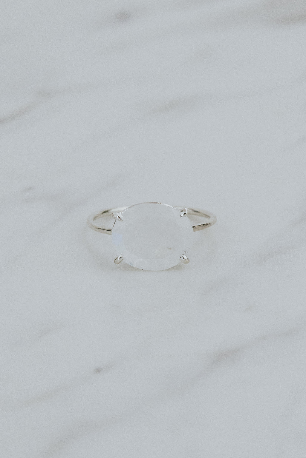 Wings Hawaii Halo ring – Moonstone in sterling silver. Fine jewelry handcrafted in Maui. Oval-cut gemstone, single prong-set on delicate band. Made in Hawaii gifts. 