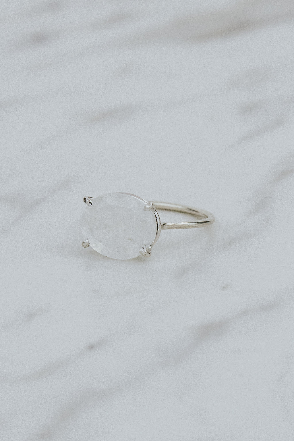 Wings Hawaii Halo ring – Moonstone in sterling silver. Fine jewelry handcrafted in Maui. Oval-cut gemstone, single prong-set on delicate band. Made in Hawaii gifts. 