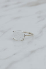 Wings Hawaii Halo ring – Moonstone in sterling silver. Fine jewelry handcrafted in Maui. Oval-cut gemstone, single prong-set on delicate band. Made in Hawaii gifts.  thumbnail