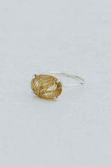 Wings Hawaii Halo ring – Rutilated Quartz in sterling silver. Fine jewelry handcrafted in Maui. Oval-cut gemstone, single prong-set on delicate band. Made in Hawaii gifts.