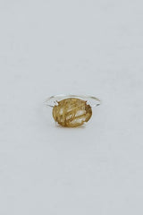 Wings Hawaii Halo ring – Rutilated Quartz in sterling silver. Fine jewelry handcrafted in Maui. Oval-cut gemstone, single prong-set on delicate band. Made in Hawaii gifts. thumbnail