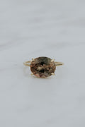Wings Hawaii Halo ring – Deep Sunstone in solid 14k yellow gold. Fine jewelry handcrafted in Maui. Oval-cut gemstone, single prong-set on delicate band. Made in Hawaii gifts. 