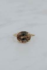 Wings Hawaii Halo ring – Deep Sunstone in solid 14k yellow gold. Fine jewelry handcrafted in Maui. Oval-cut gemstone, single prong-set on delicate band. Made in Hawaii gifts.  thumbnail