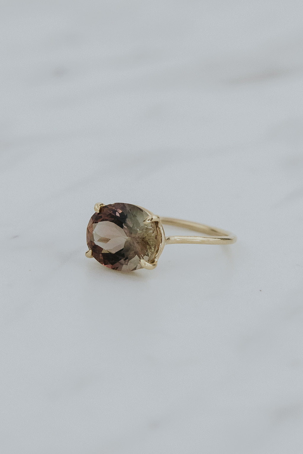 Wings Hawaii Halo ring – Deep Sunstone  in solid 14k yellow gold. Fine jewelry handcrafted in Maui. Oval-cut gemstone, single prong-set on delicate band. Made in Hawaii gifts. 